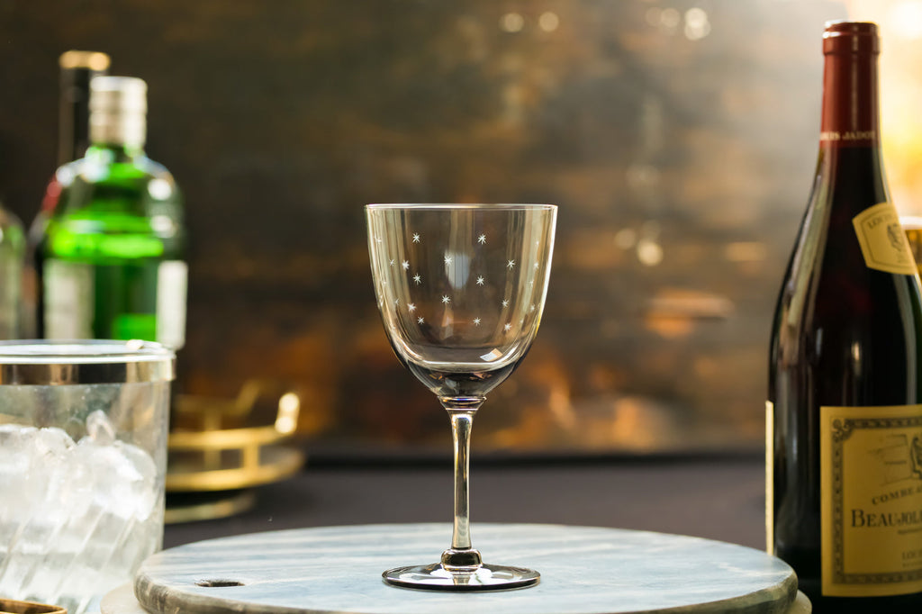 four smoky crystal wine glasses with stars design